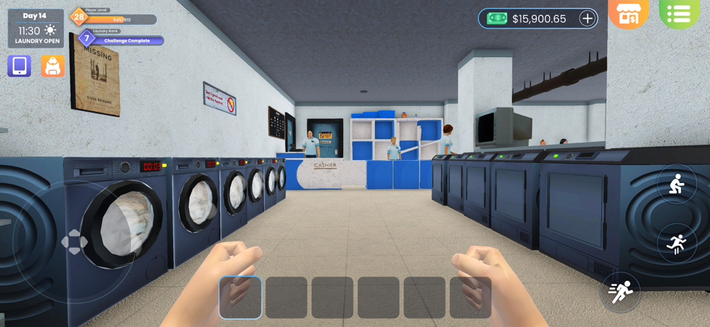 First person view of a laundry store interior with rows of washing machines and staff