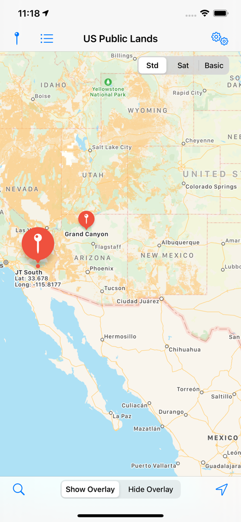 Map view in the US Public Lands app showing color coded federal land boundaries and GPS location markers in the Western United States