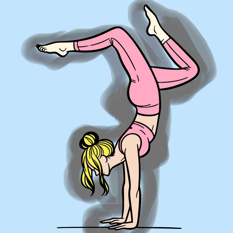 a woman doing a handstand