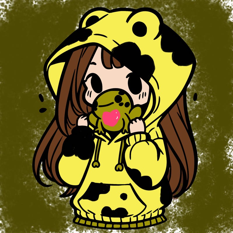 a girl holding a froggy hoodie