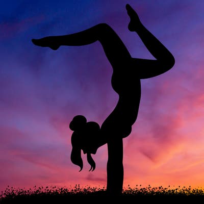 a woman doing a handstand