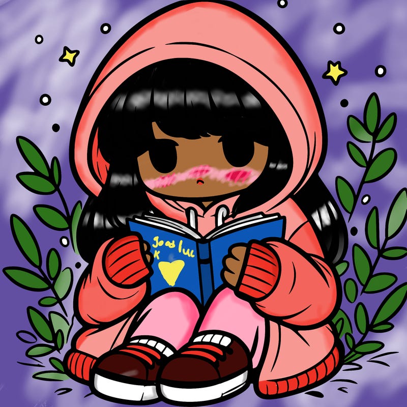 girl in oversized hoodie reading a book