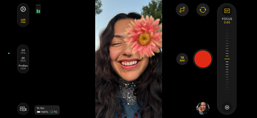 Interface of Final Cut Camera app showing professional manual focus slider and recording settings while filming a person