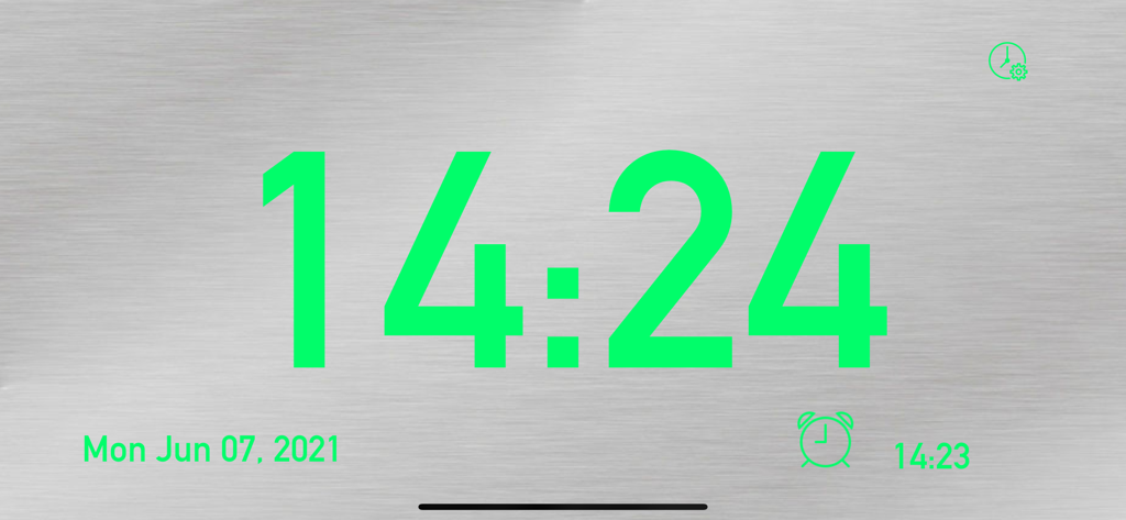 Große grüne Digitaluhr auf einem gebürsteten silbernen Hintergrund