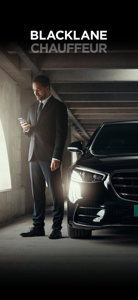 Professional chauffeur in a suit using the Blacklane app next to a luxury vehicle