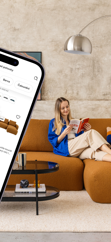 Bonami – Your Unique Home - A woman reading on a designer sofa with the Bonami app shown on a smartphone in the foreground