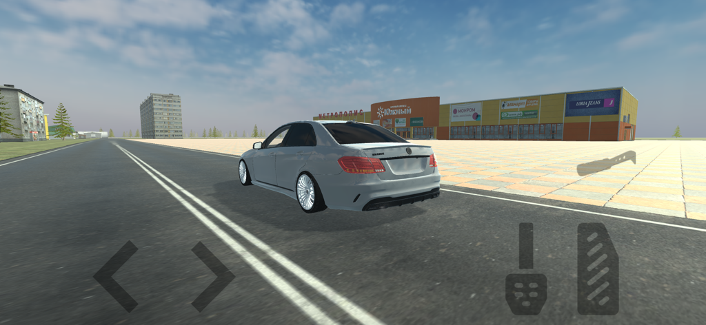 A gray car driving past buildings in the Simulator Real Oper Car mobile game
