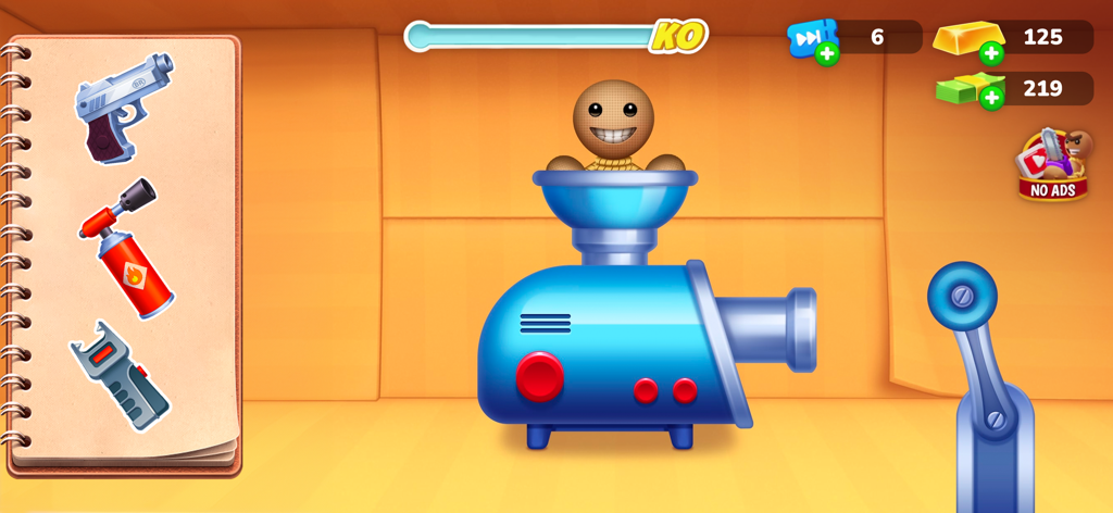 Captura de pantalla del juego móvil Kick the Buddy mostrando a Buddy el muñeco de trapo dentro de una máquina azul con opciones de armas en pantalla.