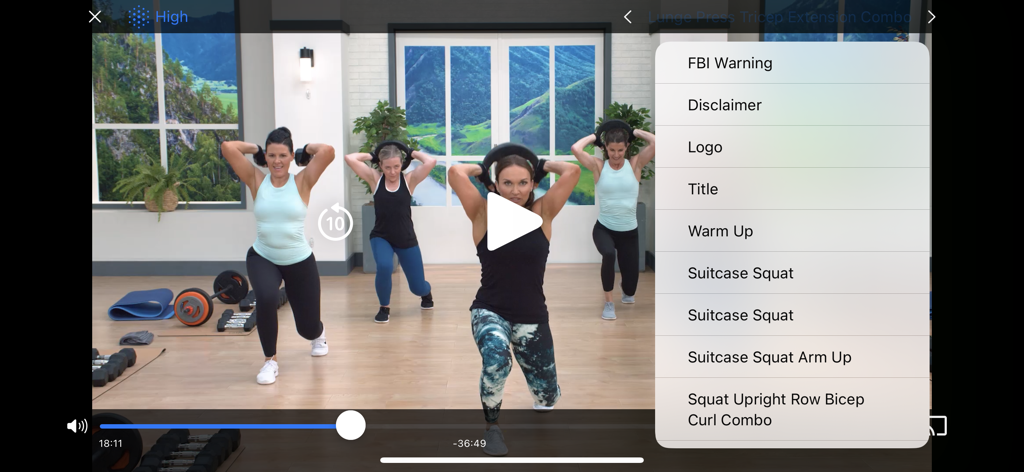 Cathe OnDemand - Cathe OnDemand app showing a workout video with a side menu for selecting specific exercise chapters