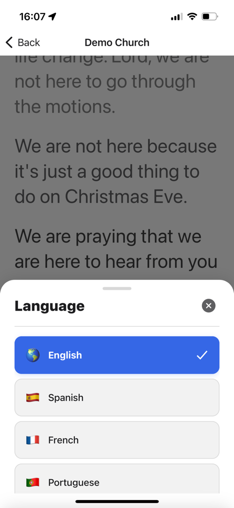 Kaleo AI - Language selection menu in the Kaleo AI app showing options for English, Spanish, French, and Portuguese translation over live church service captions.