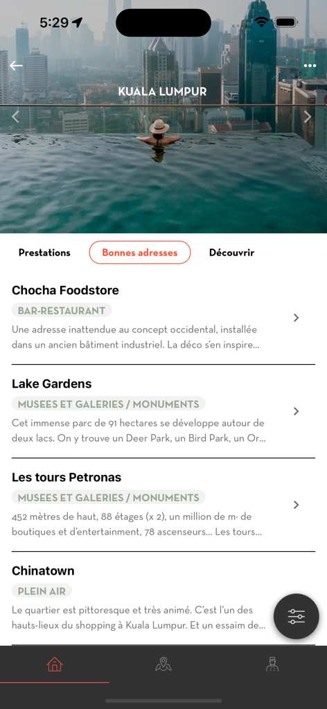 Voyageurs du Monde - Voyageurs du Monde app displaying curated travel recommendations for Kuala Lumpur