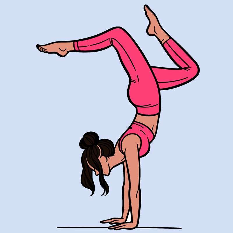 a woman doing a handstand