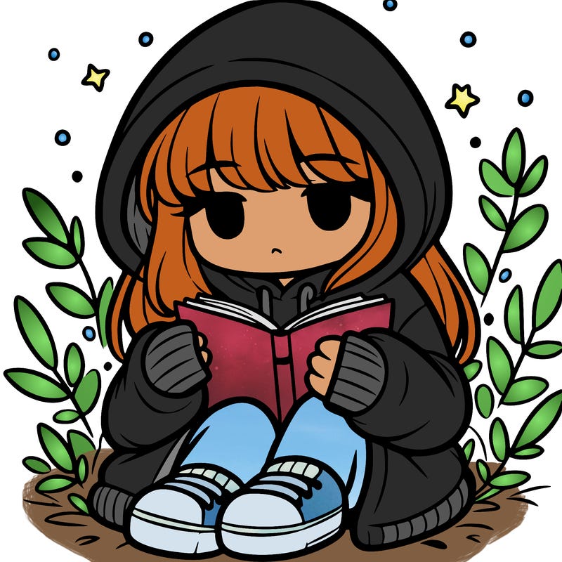 girl in oversized hoodie reading a book