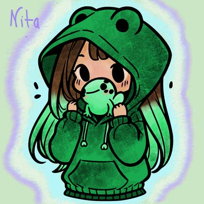 a girl holding a froggy hoodie