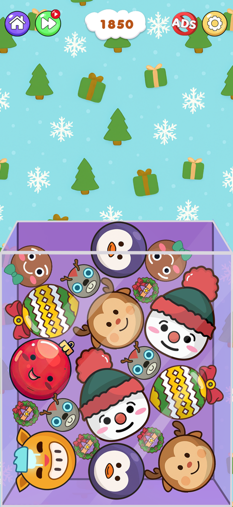 Gameplay screenshot of Fruit Merge Watermelon Puzzle featuring a festive winter theme with snowman and penguin characters