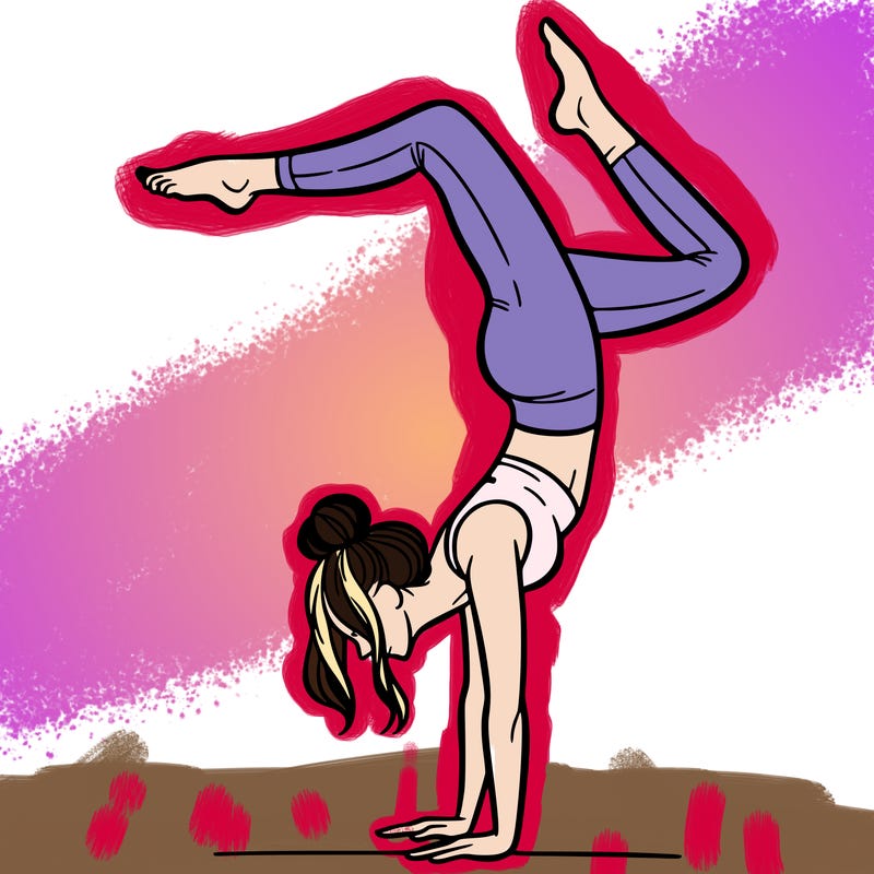a woman doing a handstand