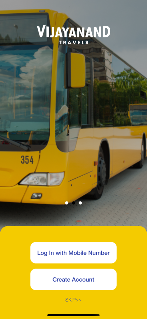 Vijayanand Travels - Login screen of the Vijayanand Travels mobile app featuring a yellow bus background and options to sign in or create an account
