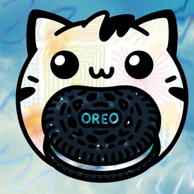 oreo in a cat’s mouth