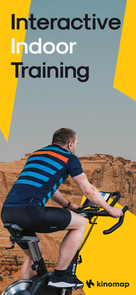 Kinomap: Bike, Run, Row - A man using the Kinomap app on an indoor exercise bike with a scenic canyon route on screen