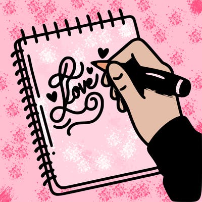 a hand writing “love” in calligraphy on a notebook