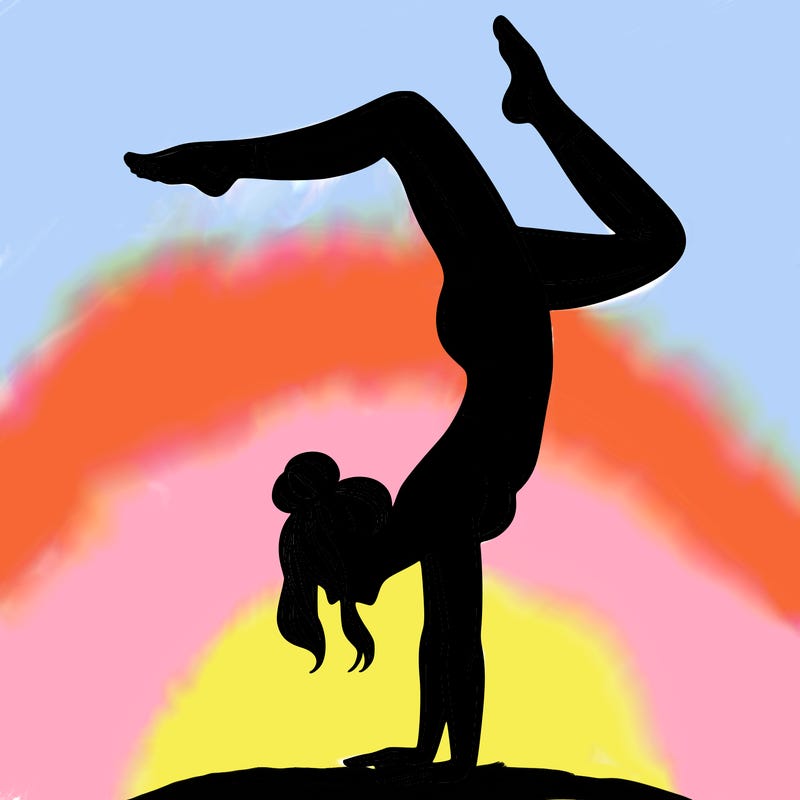 a woman doing a handstand