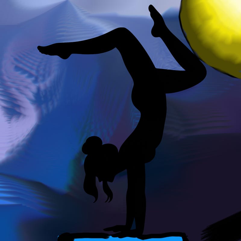 a woman doing a handstand