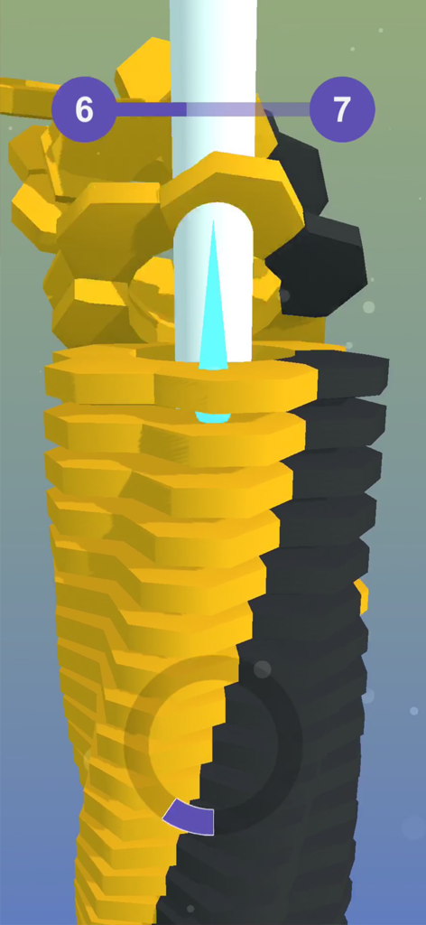 Stack Ball 3D ! - A blue ball smashing through a tower of yellow and black hexagonal tiles in the Stack Ball 3D mobile game.