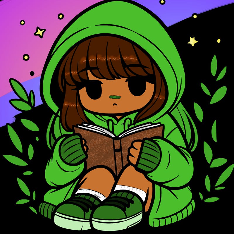 girl in oversized hoodie reading a book