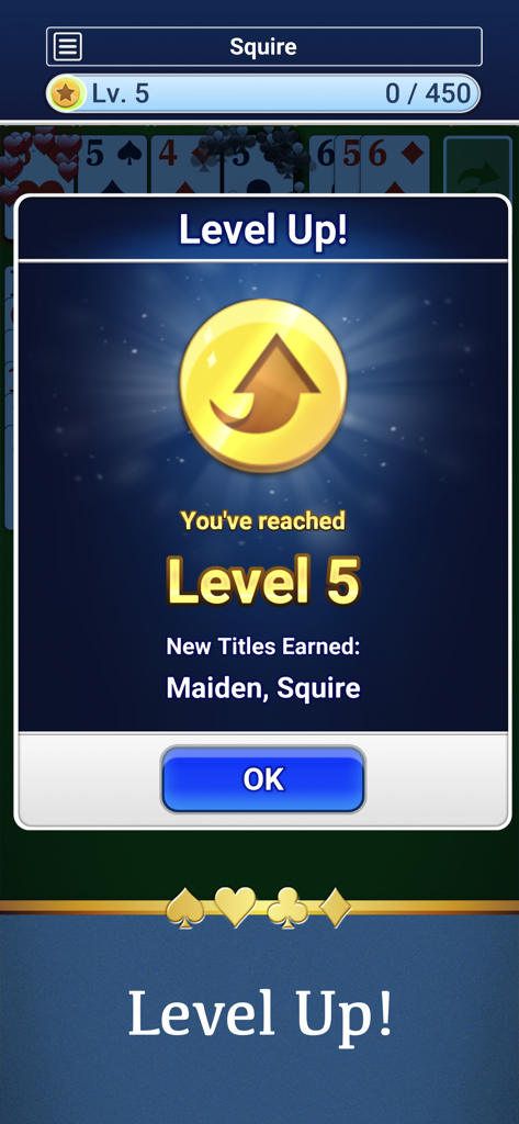Solitaire - Captura de pantalla de Solitaire de MobilityWare que muestra una notificación de Subir de Nivel para el Nivel 5 con los títulos ganados Maiden y Squire