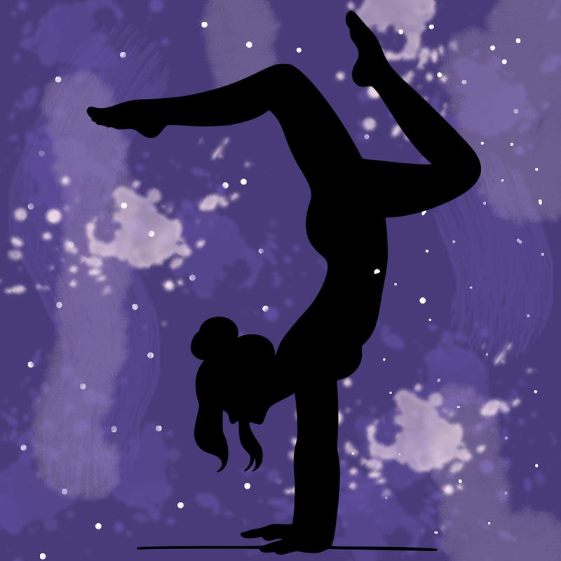 a woman doing a handstand