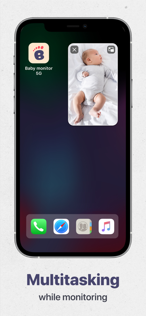 Schermata iniziale dell'iPhone che mostra l'app Baby Monitor 5G in una finestra picture-in-picture per il multitasking durante il monitoraggio di un bambino che dorme