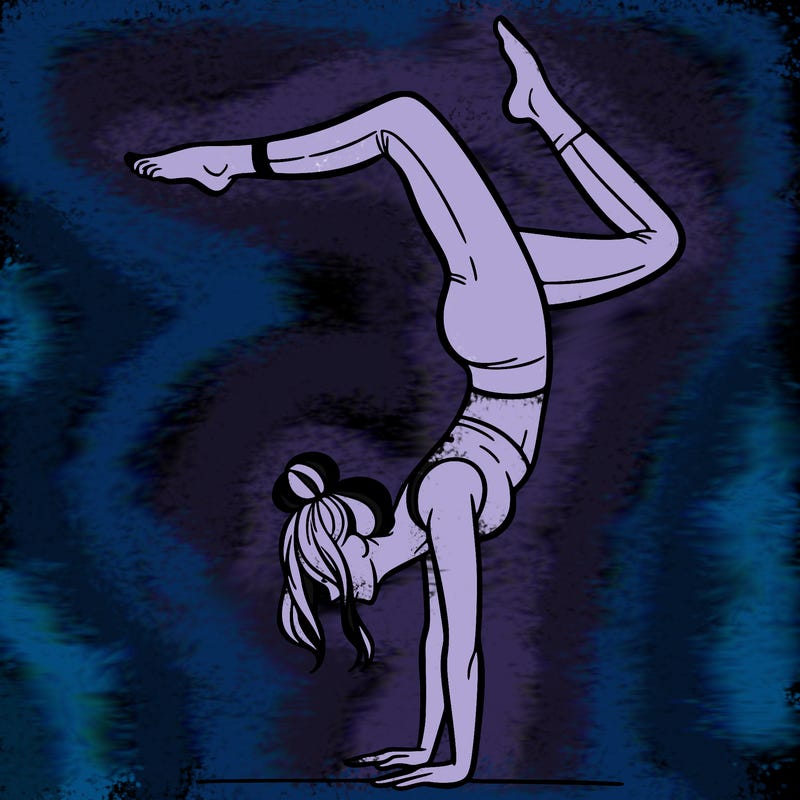 a woman doing a handstand