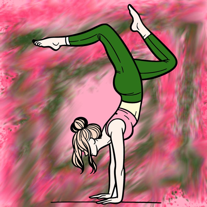 a woman doing a handstand