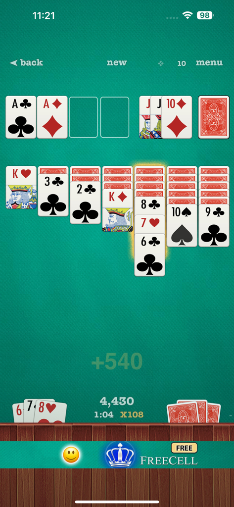 Classic klondike solitaire card game with extra large symbols on a green background