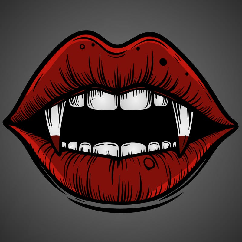 lips with vampire teeth