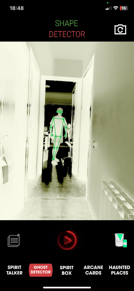 Spirit Whisper - Ghost Talker - Ghost detector screen showing a green skeletal figure tracked in a hallway within the Spirit Whisper app