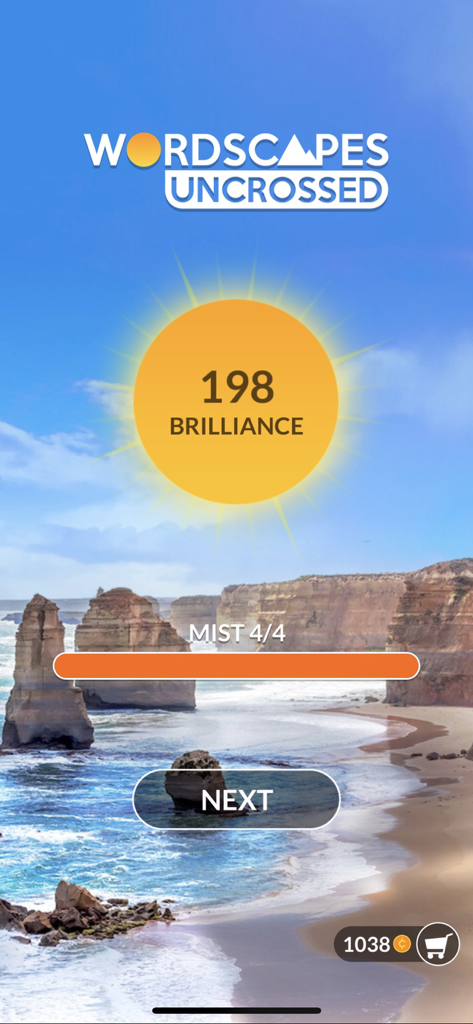 Wordscapes Uncrossed level completion screen showing 198 brilliance points over a scenic ocean cliff background.