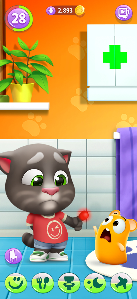 Talking Tom caring for his small orange pet in a bathroom with a first aid kit