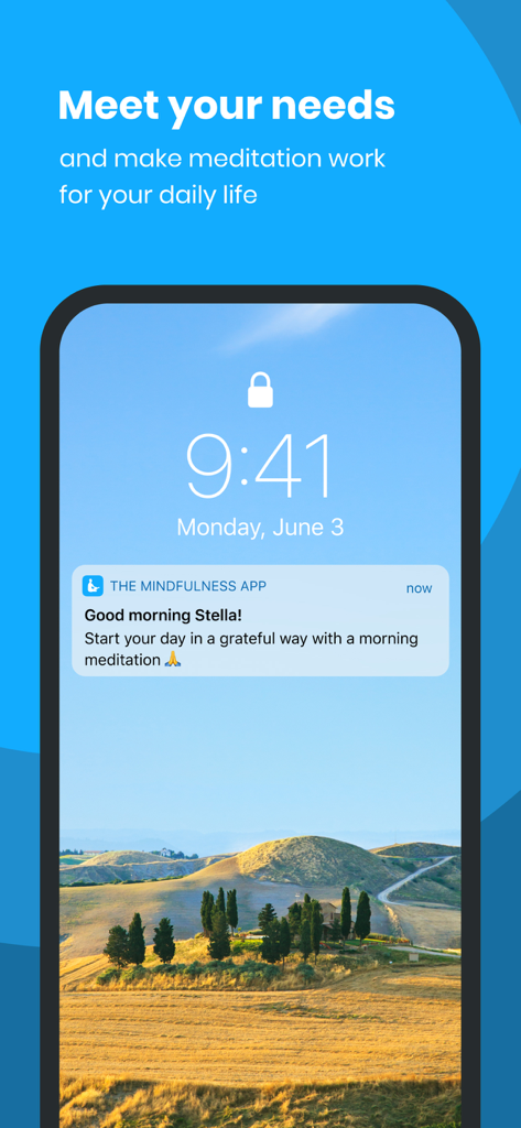 Uma tela de bloqueio de smartphone mostrando uma notificação de meditação matinal do The Mindfulness App contra uma paisagem pacífica de colina.