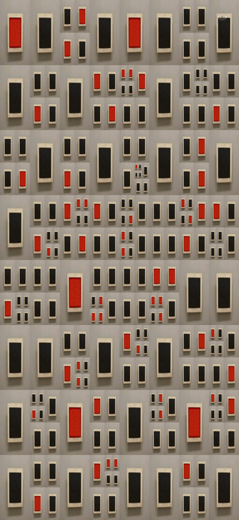 視覚的なリラクゼーションのための、明るい灰色の背景にある赤と黒の長方形フレームのミニマリストパターン