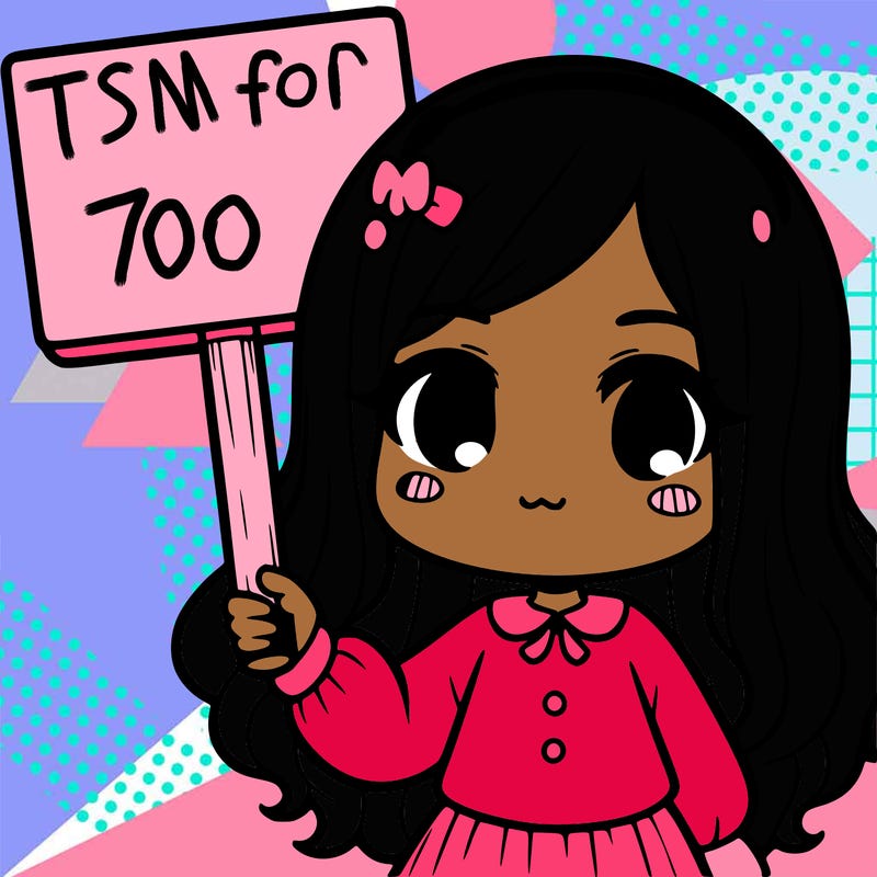 a girl holding a sign