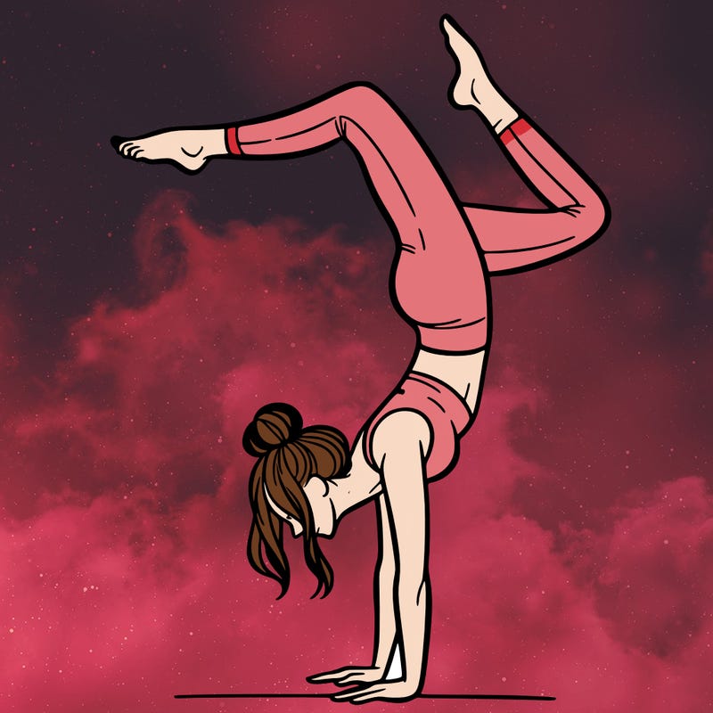 a woman doing a handstand