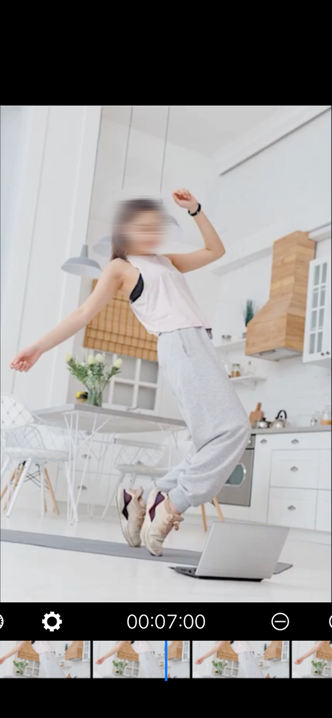 MosaicEditor Video App - A woman dancing in a kitchen with her face blurred using the MosaicEditor video privacy tool