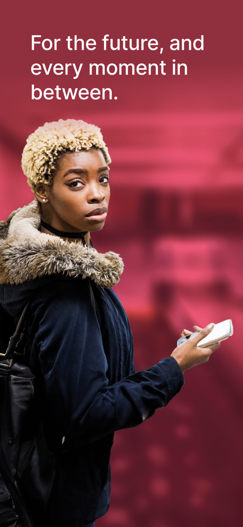 A woman holding a smartphone with the slogan For the future and every moment in between on a red background