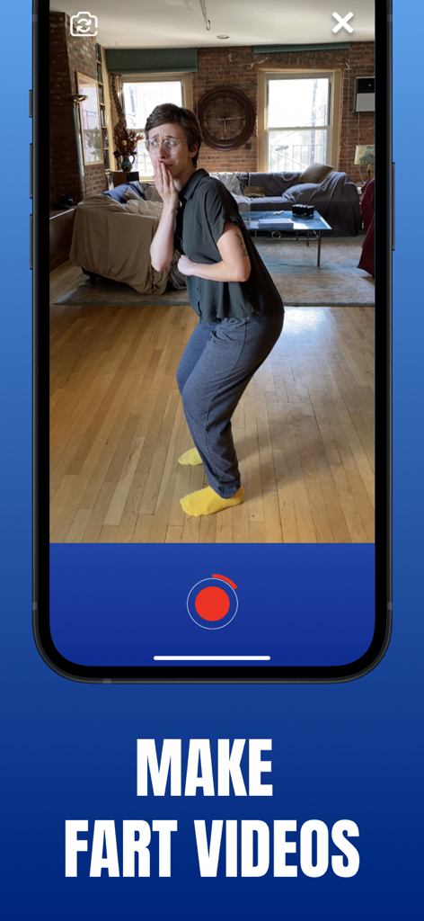 A person using the Fart World app to record a prank video in a living room.