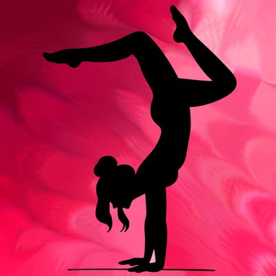 a woman doing a handstand