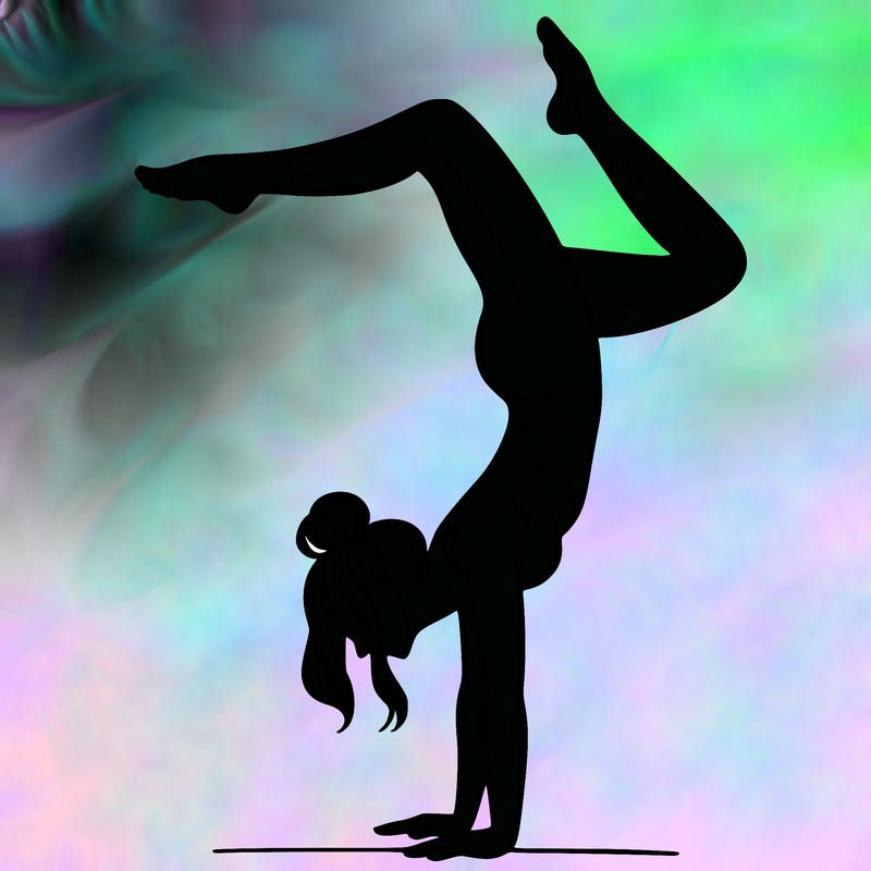 a woman doing a handstand