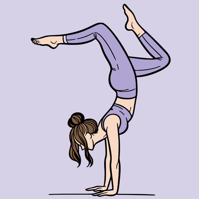 a woman doing a handstand