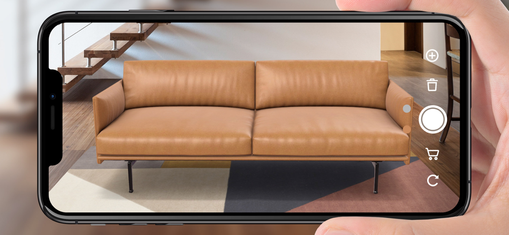 top3 AR | Augmented Reality 3D - Smartphone mostrando una visualización de realidad aumentada de un sofá de cuero marrón en una sala de estar