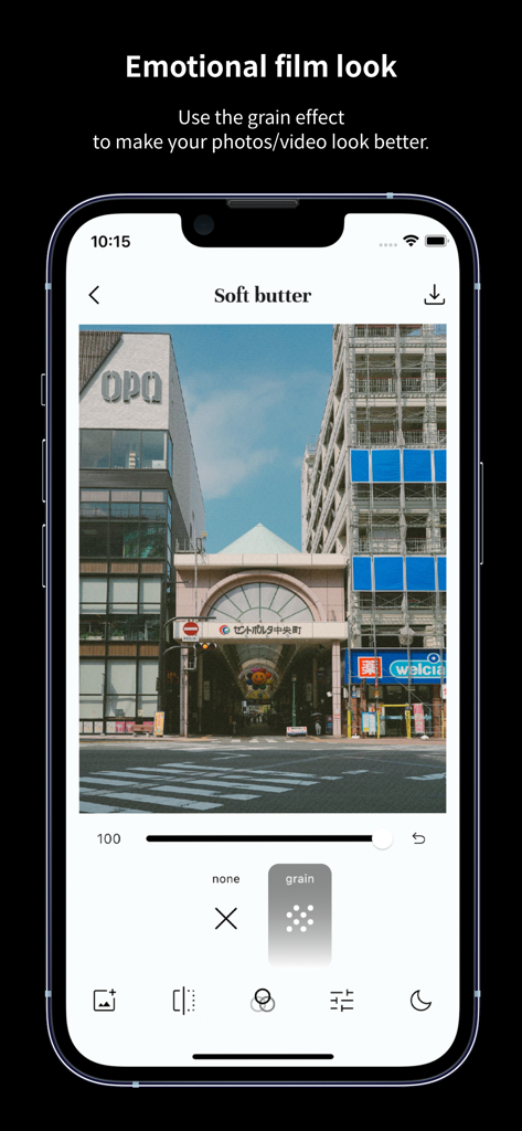 Smartphone interface of FilmN app showing a grain effect adjustment on a travel photo with the Soft Butter filter